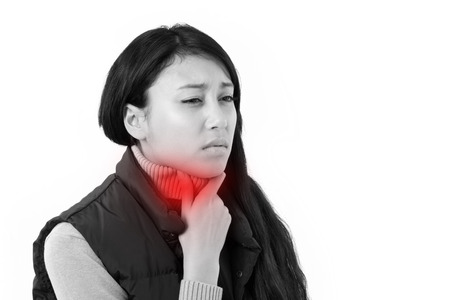 sick woman suffering from sore throatの写真素材