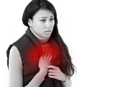 woman suffering from acid reflux or heartburnの写真素材