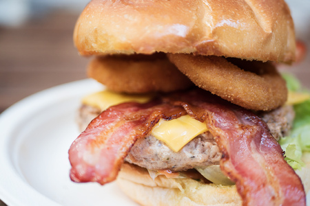 cheese burger with crispy onion ring and baconの写真素材