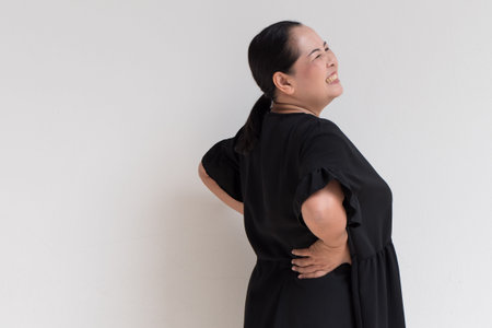 woman suffering from back pain, spinal injury, muscle issue problem