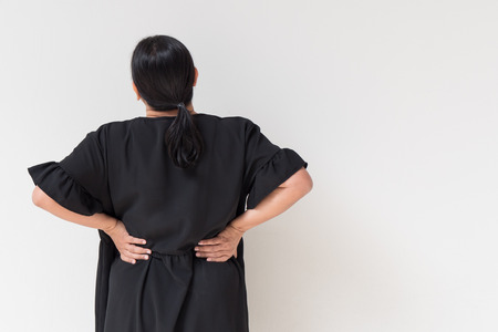 woman suffering from back pain, spinal injury, muscle issue problemの写真素材