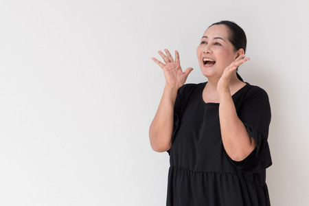 Cheerful middle age woman looking upの写真素材