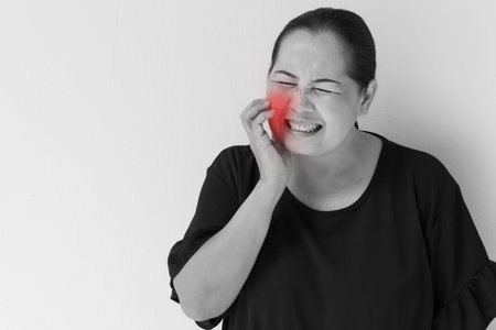 woman suffering from toothache, tooth sensitivity, decay, oral problem