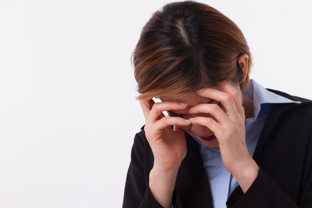 sick, ill, tired, stressful, exhausted business woman suffers from headache, stress, vertigo, migraine, hangover, depression, dizziness, office syndrome, overworkの写真素材