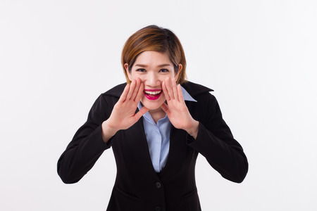 happy, successful, confident businesswoman shouting, communicationg, announcingの写真素材