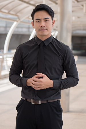 serious businessman looking at youの写真素材