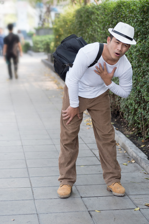 sick man suffering from heart attackの写真素材