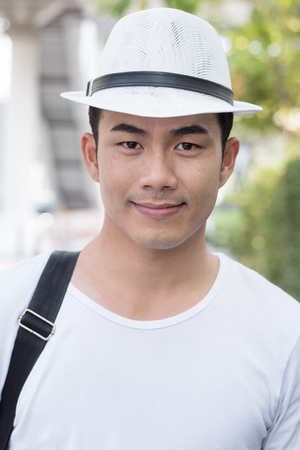 portrait of confident asian man travellerの写真素材