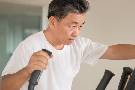 old senior man working out with modern equipment
