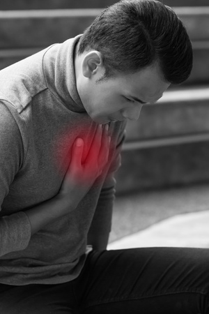 Sick man suffering from heart attack, chest painの写真素材