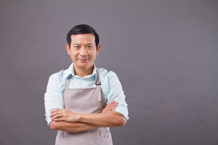 Confident shopkeeper, small business owner, shop manager, entrepreneur studio isolatedの写真素材