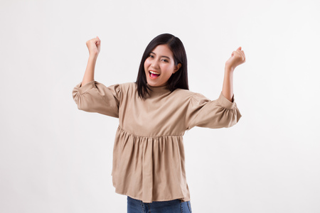 excited happy smiling smart casual arab asian woman posing cheerful, successful poseの写真素材