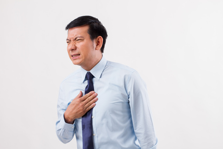 sick man suffering from acid reflux, gerd, heartburn, indigestionの写真素材