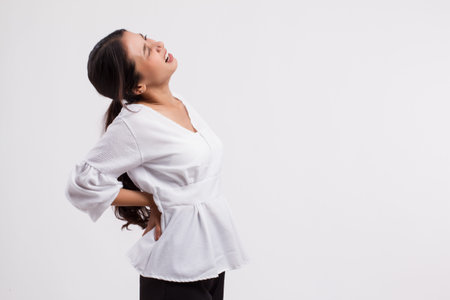 woman suffering from back pain, backbone or spinal muscle injury