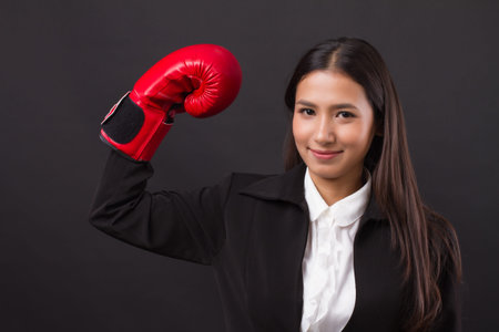 strong business woman punching, powerful impact on business competition concept