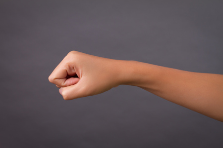 punching woman hand studio isolatedの写真素材