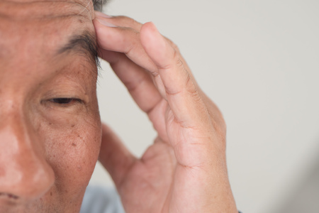senior old man suffering from dementia or memory lossの写真素材