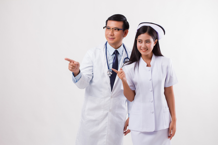 doctor and nurse medical team pointingの写真素材