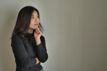 woman thinking planning with idea, girl thinks with spaceの写真素材