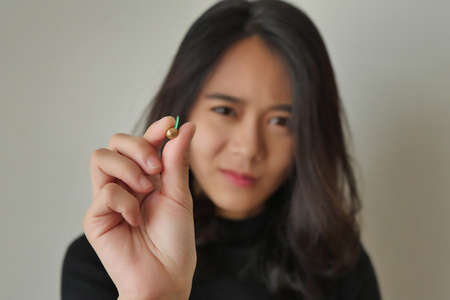 woman aiming dart, concept of target or goalの写真素材