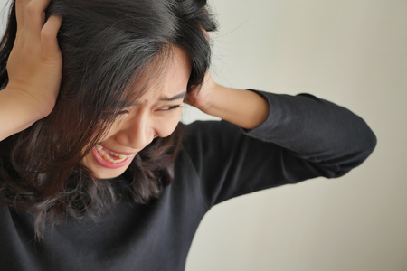 woman screaming or shouting with stress, mental illness, depressionの写真素材