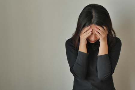 girl face palm gesture, depressed womanの写真素材