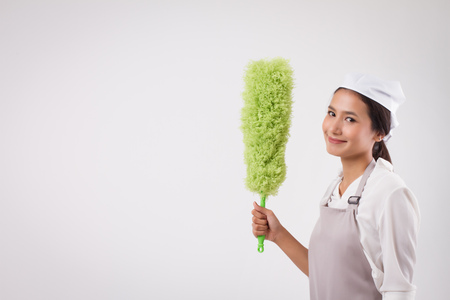 happy smiling confident professional asian woman domestic worker, girl housework homework helper, woman housekeeper housewife, girl cleaner, woman maid, girl cleaning service girl hand holding dusterの写真素材