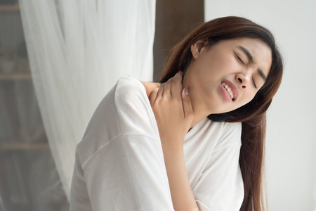 woman with shoulder or neck painの写真素材