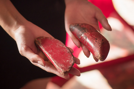asian woman hand holding yin yang fortune telling wood with positive, lucky outcome; concept of happy chinese fortune telling, astrology, luck, future prediction; asian young adult woman modelの写真素材