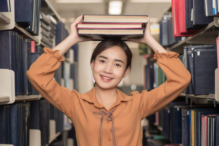 smart woman college student searching books; portrait of happy smiling woman university student...