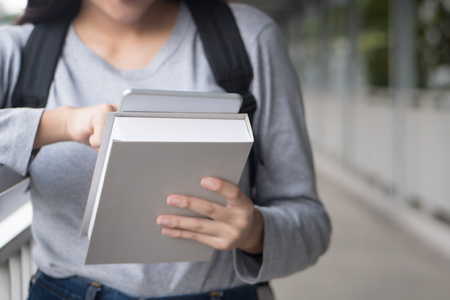 female college student using tablet computer, online education stydy course and education technology concept, southeast asian woman modelの写真素材