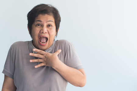portrait of negative, excited, surprised old womanの写真素材