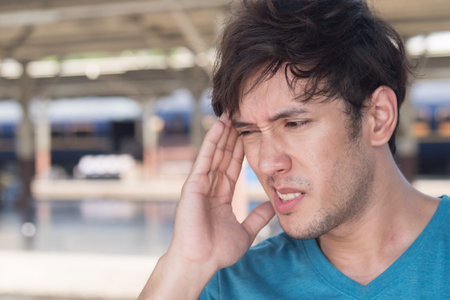 sick, stressful, depressed man suffering from headache