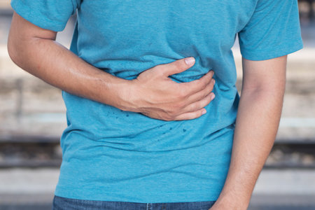 sick man suffers from stomach ache, diarrhea, constipation, indigestion, flatulence; food poisoning