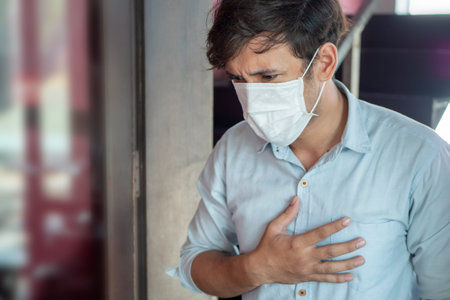 man wearing air filter mask having Dyspnea, breathing difficulty, respiratory distress in unhealthy,...