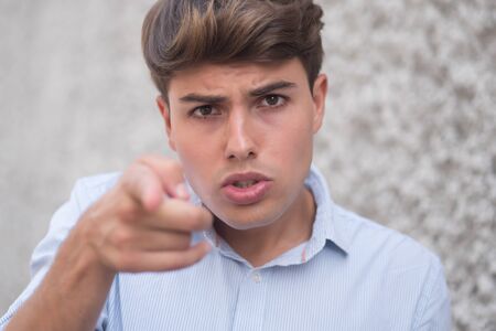 angry man pointing finger at youの写真素材
