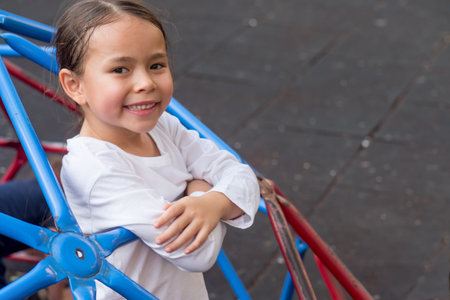 cute little girl playing in kid playground