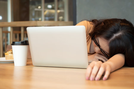 serious asian business woman; tired, exhausted woman office worker working at home; concept of...