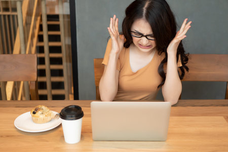 angry asian business woman; upset angry woman office worker working at home; concept of business in...