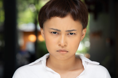 pensive, thoughtful LGBT woman thinking, portrait of unhappy lgbt girl looking at you