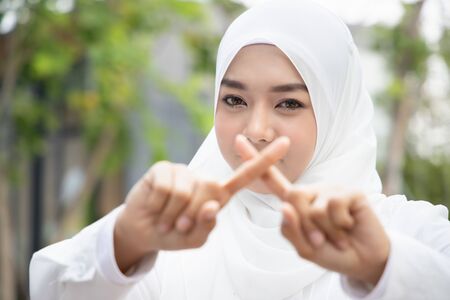 muslim woman asking for silence, no noiseの写真素材