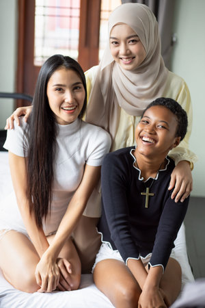 A group of multi ethnic friends, multi racial women with different religions; concept of people with...