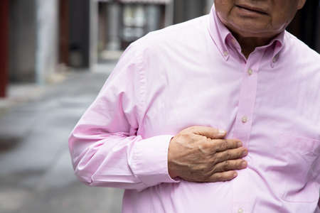 Old senior man with reflux sicknessの写真素材