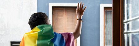 Black African LGBT woman holding LGBTQ rainbow flag, lesbian pride or LGBT pride movement,...