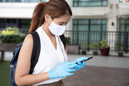 woman with blue rubber glove using smartphone, concept of telemedicine, online shopping, online food...