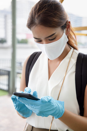 woman with blue rubber glove using smartphone, concept of telemedicine, online shopping, online food...