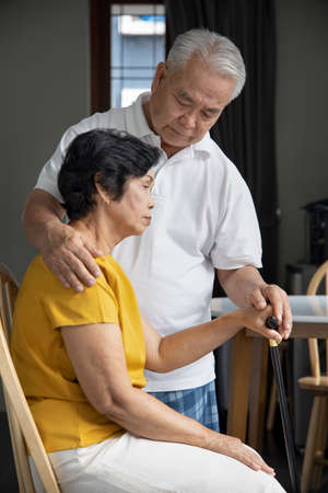 Hand of old senior couple staying together, caring each other, concept of old senior couple retirement or retirement home, love and care at old ageの写真素材