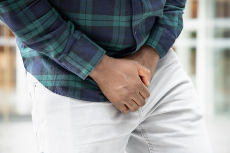 African man suffering from prostate cancer, sick African black man with prostate cancer, premature ejaculation, fertility, bladder problem, health care, cancer sickness conceptの写真素材
