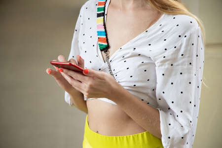 woman using smartphone; portrait of white caucasian woman with smartphone, concept of online shopping, internet connection, online deal, smartphone app transaction, telemedicineの写真素材
