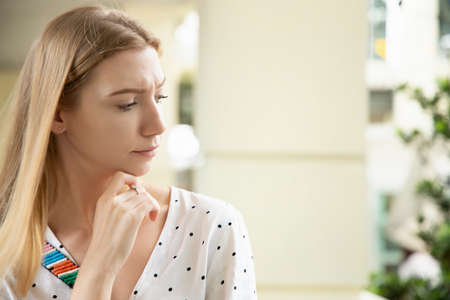 serious unhappy white woman thinking, worrying in negative moodの写真素材